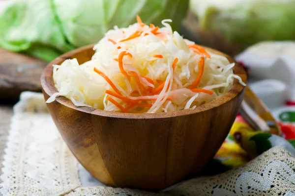 Sauerkraut in a wooden bowl — Stock Photo, Image