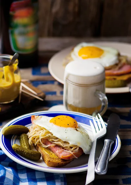 Sandwich with sauerkraut , ham and fried eggs — Stock Photo, Image