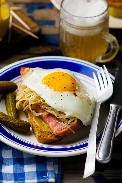 Sandwich with sauerkraut , ham and fried eggs — Stock Photo, Image