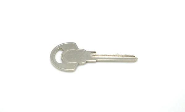 Uma chave isolada no fundo branco — Fotografia de Stock