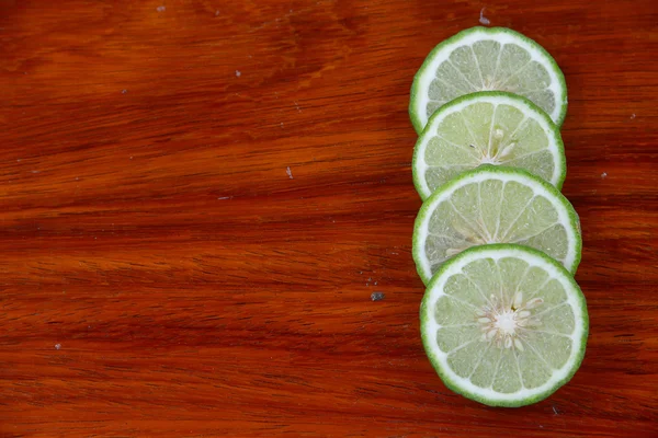 Lemon juice on the wooden floor. — Stock Photo, Image