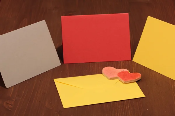 Colorful envelopes on a wooden — Stock Photo, Image