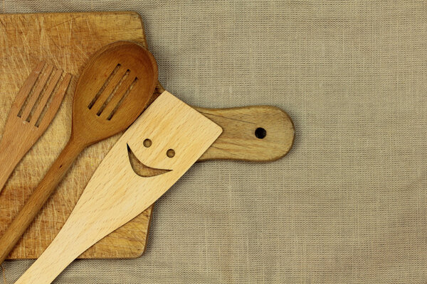 Wooden spoon and fork on linen