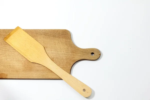 Cutting board and spatua  on a white background — Stock Photo, Image