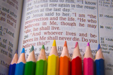 Bible text John 11:25 and crayons clipart