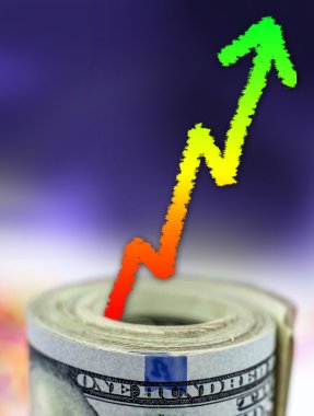 Büyüme gösteren grafik ile para yığını