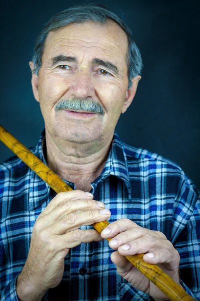 Man playing on pipe flute — Stock Photo, Image