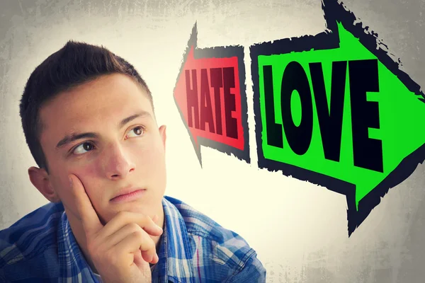 Portrait of handsome teenager faced with choice between HATE and — Stock Photo, Image