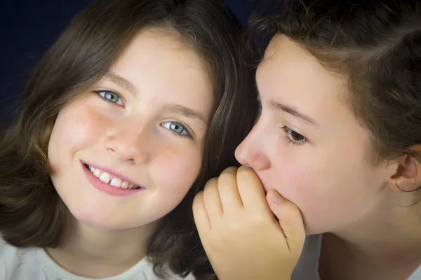 Two teenage girls telling secret — Stock Photo, Image