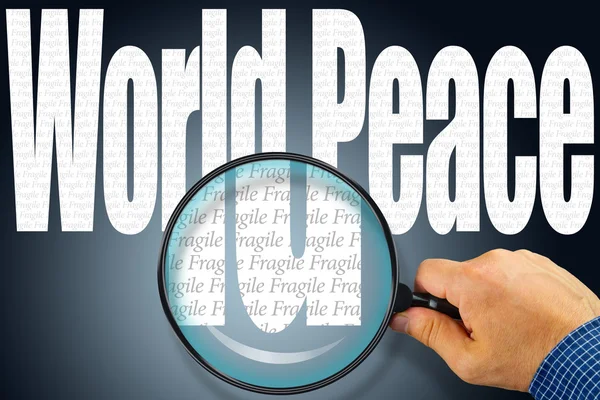 Les mots WORLD PEACE sous observation avec loupe — Photo