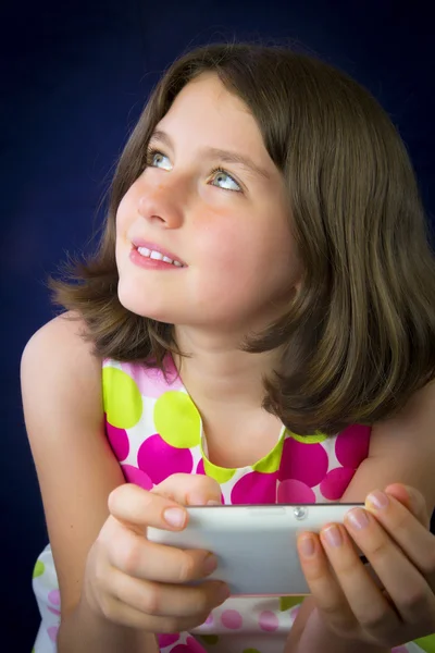 Portrait of beautiful little girl with cell phone — Stock Photo, Image