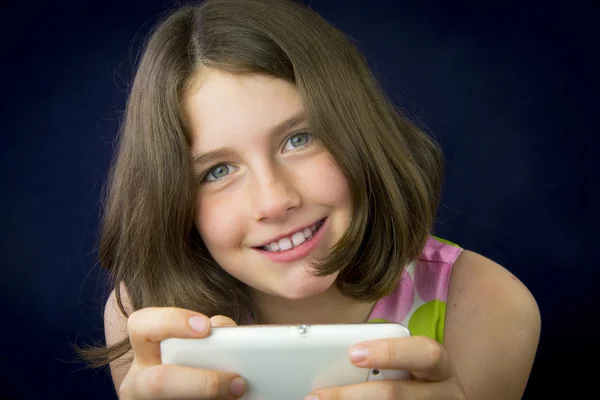 Portrait of beautiful little girl with cell phone — Stock Photo, Image
