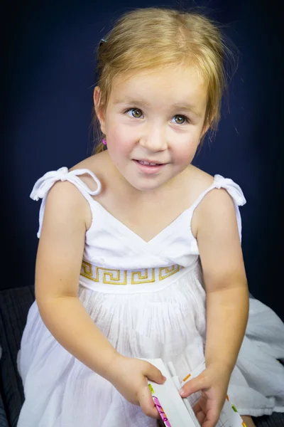 Beautiful little girl with blond hair — Stock Photo, Image