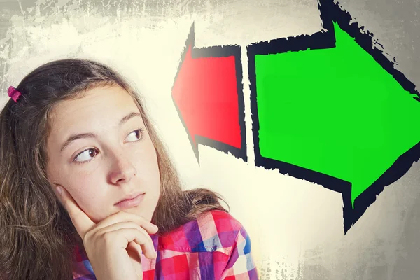 Portrait of beautiful teenage girl faced with choice — Stock Photo, Image