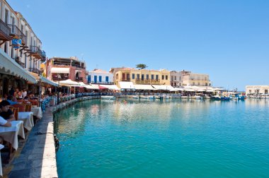 CRETE,RETHYMNO-JULY 23: The venetian harbour with the various bars and restaurants in Rethymno city on July 23,2014. Crete island, Greece. clipart
