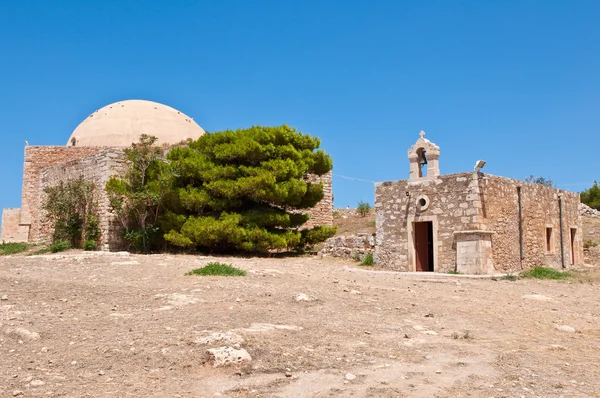 Sultan Ibrahim mosque and church of Agia Ekaterini on Crete, Greece. Rethymno city. Crete, Greece. Stock Image