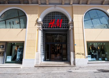ATHENS-AUGUST 22: H&M store showcase on Emrou street on August 22,2014 Athens, Greece. clipart