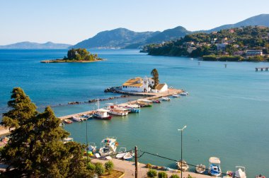 Pontikonisi and Vlacheraina Orthodox monastery from the hilltop of Kanoni on the island of Corfu, Greece.