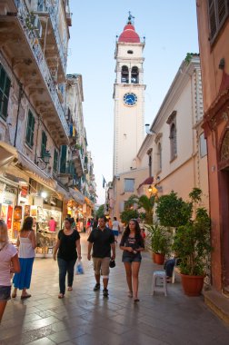 CORFU-AUGUST 22: Kerkyra street in the old part of the city with the row of souvenirs shops on August 22, 2014 on Corfu island, Greece.