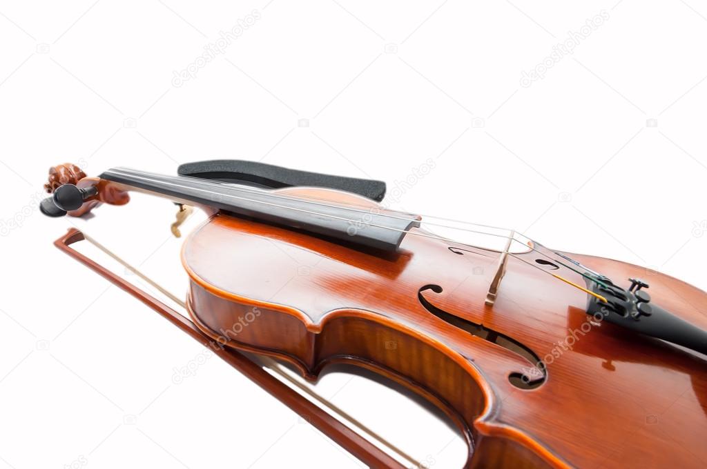 Classic violin with the fiddlestick isolated on white.