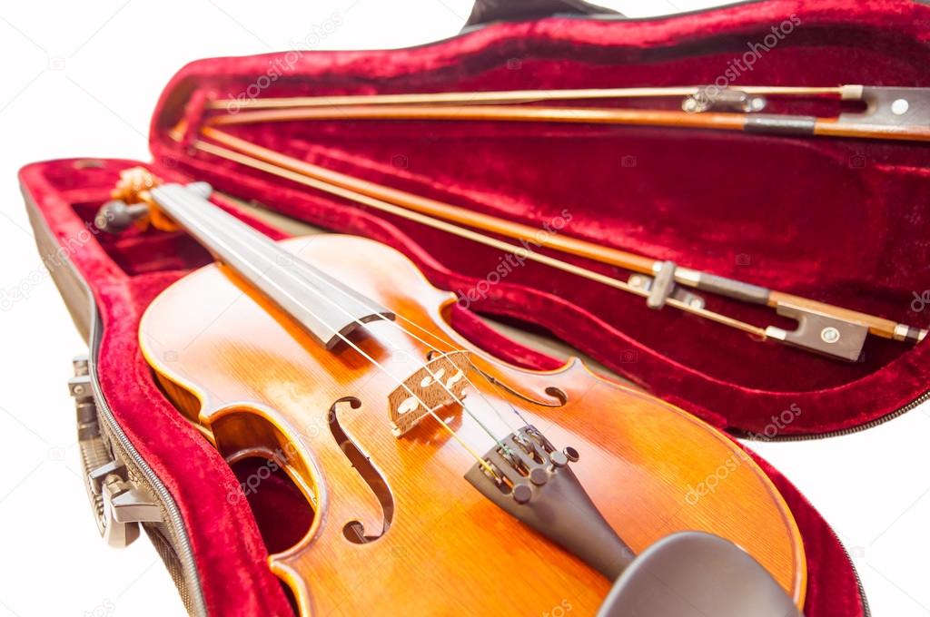 Classic violin with the fiddlesticks in the  fiddle-case isolated on white.