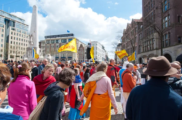 AMSTERDAM,NETHERLANDS-APRIL 27: Locals and tourists in orange on funfair during King's Day on April 27,2015 in Amsterdam.