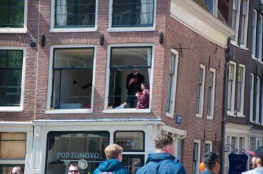 AMSTERDAM-APRIL 27: People celebrate King's Day in Amsterdam apartment on April 27,2015.