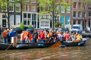 AMSTERDAM-APRIL 27:  King's Day boating, locals have fun on the boats on April 27, 2015 in Amsterdam, the Netherlands.