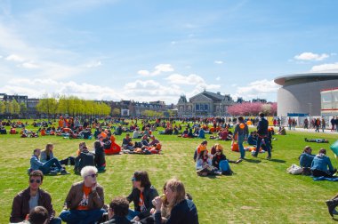 AMSTERDAM-APRIL 27: People relax at the Museumplein on King's Day on April 27,2015.