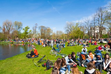 AMSTERDAM-APRIL 27: Locals and tourists in orange celebrate King's Day in on April 27,2015 in Vondelpark.