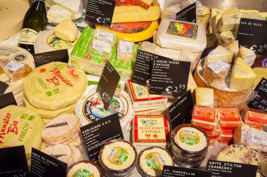 AMSRETDAM-APRIL 28: Traditional brands of Dutch cheese displayed for sale in a local shop on April 28,2015. clipart