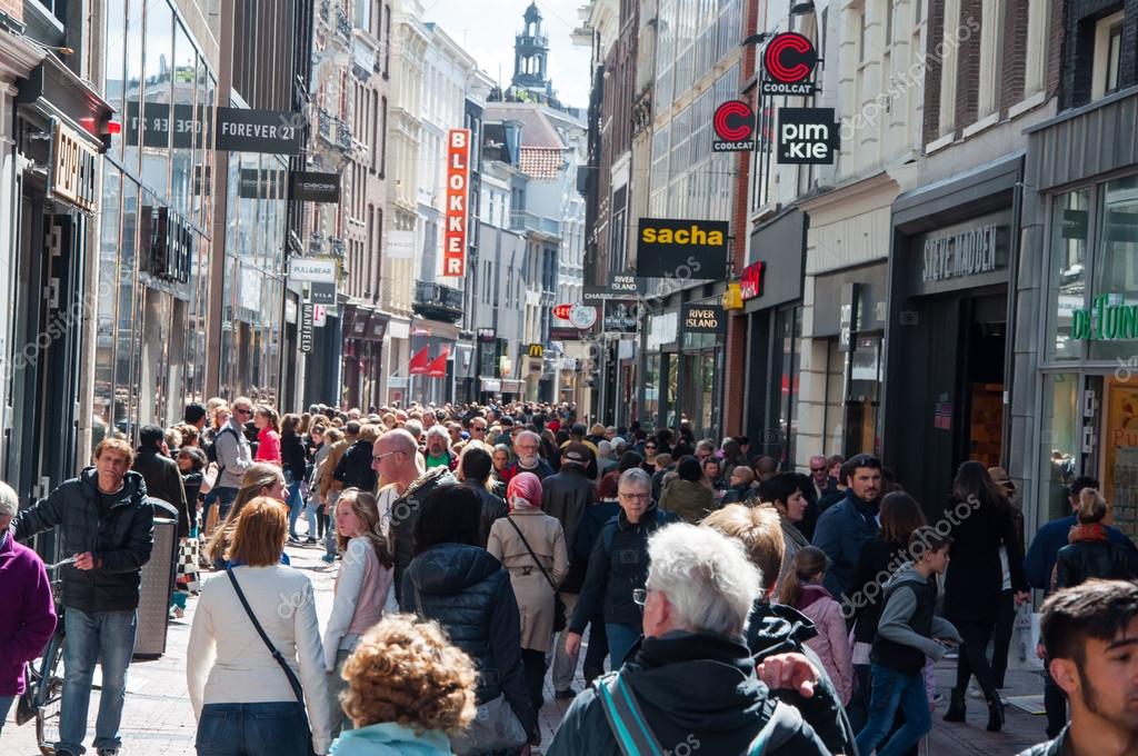 AMSTERDAM-APRIL 30: Kalverstraat shopping street, people go shopping on