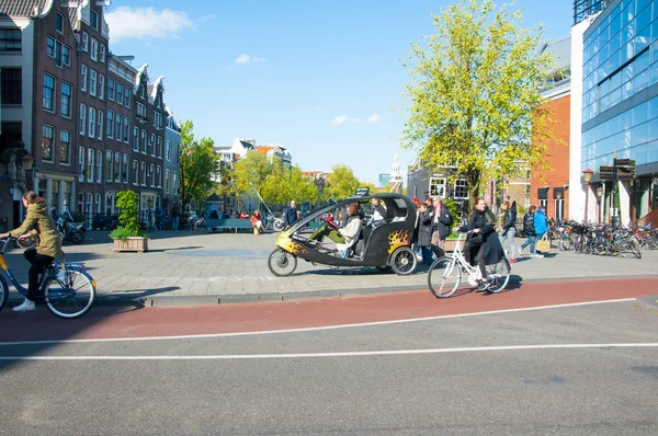Amsterdam downtown, bicycle taxi waits for clients. — Stockfoto