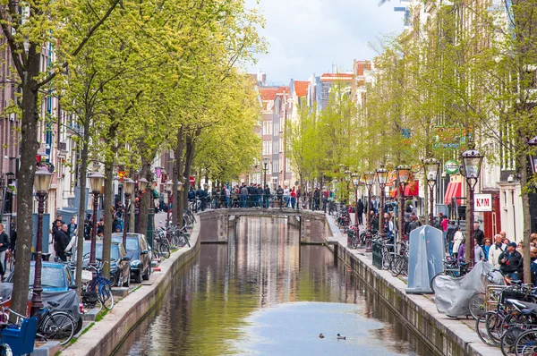 Amsterdam-April 30: Amsterdam Red Light District, crowd of tourists go sightseeing on April 30,2015.