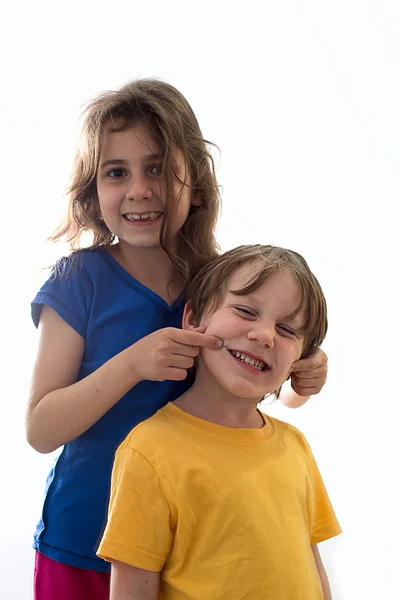 Duas crianças sorrindo engraçadas Imagem De Stock
