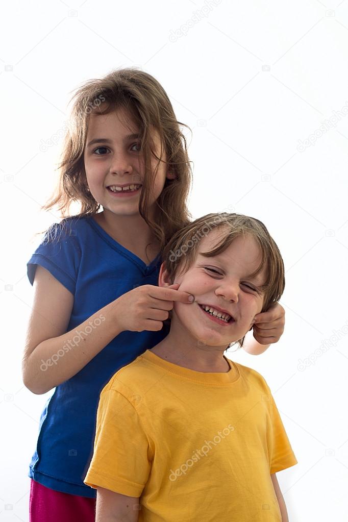 Two funny smiling little children