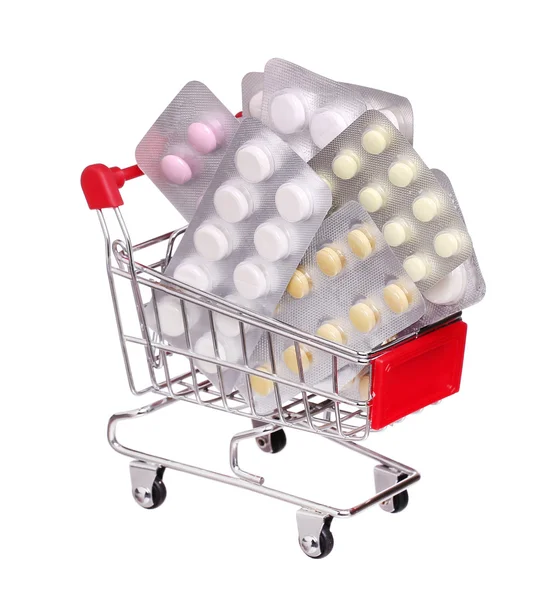Pillen in winkelwagen geïsoleerd op witte achtergrond — Stockfoto