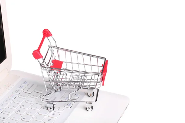 Online shopping. cart on laptop isolated on white background — Stock Photo, Image