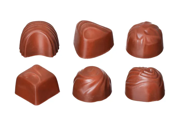 Коллекция шоколадных конфет на белом фоне — стоковое фото