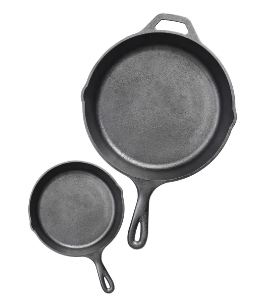 Cast iron frying pans Isolated on white background Stock Photo by