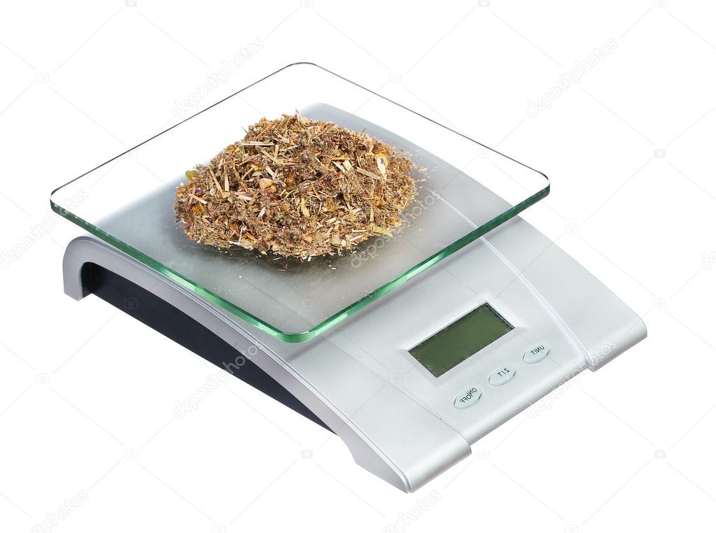 food scale with herbs electronic and digital isolated on white b