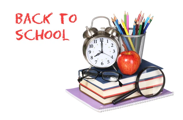 Books, apple, alarm clock and pencils isolated on white backgrou — Stock Photo, Image