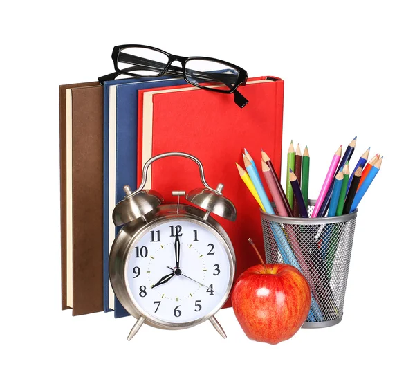 Books, apple, alarm clock and pencils isolated on white backgrou — Stock Photo, Image