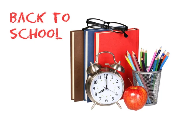 Books, apple, alarm clock and pencils isolated on white backgrou — Stock Photo, Image