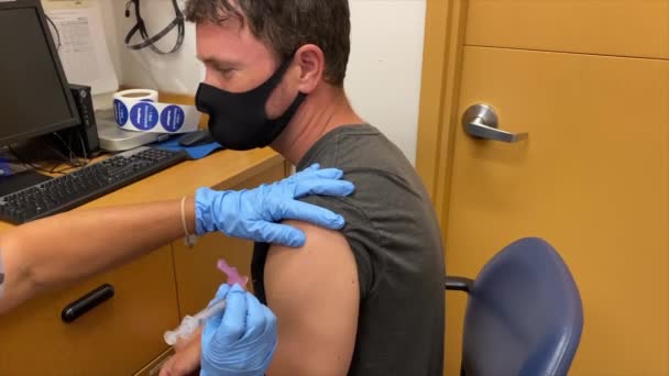 Man Gets Covid Vaccination Doctor Office Gives Little Smile Shot — Stock Video