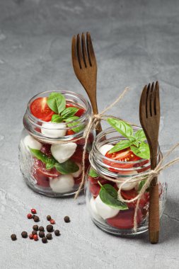 Caprese salad in mason jars clipart