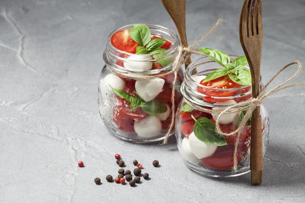 Caprese salad in mason jars — Stock Photo, Image