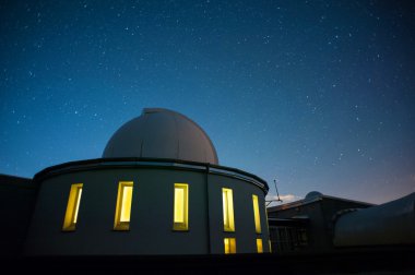 Astronomical observatory dome in night clipart