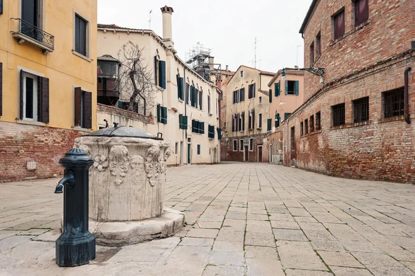 Typical square and fountain. — Stock Photo, Image