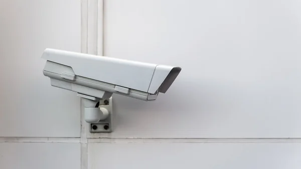 Isolated Security Camera on a wall. — Stock Photo, Image